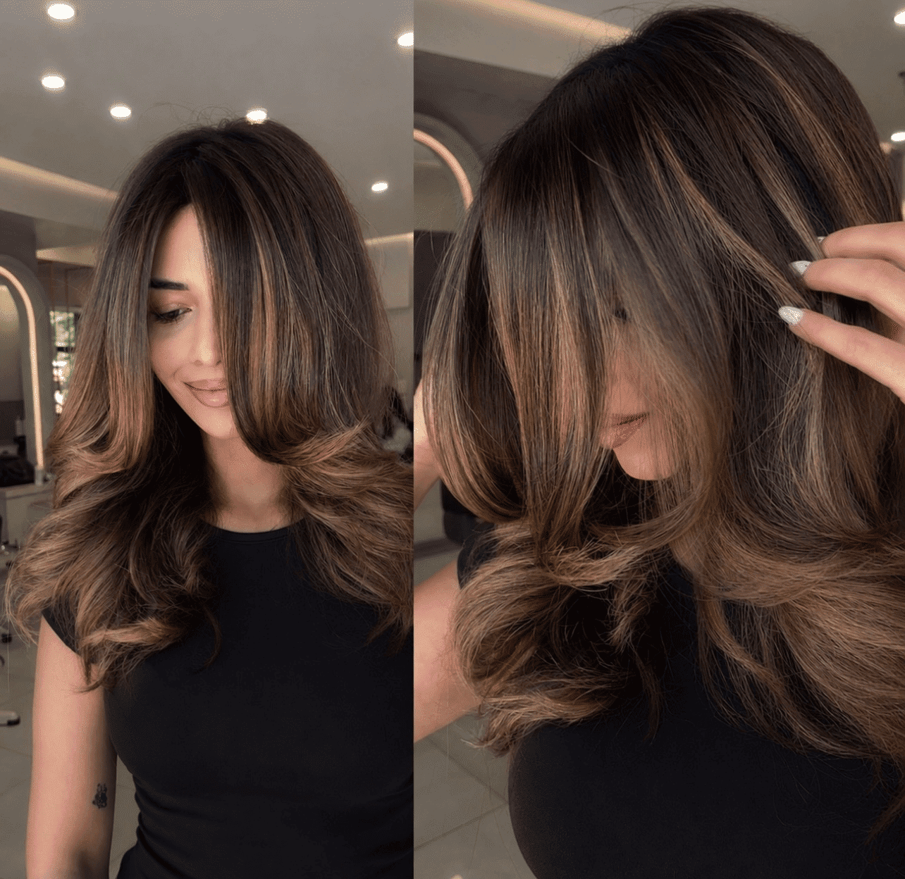 Woman with brown wavy hair and highlights in a salon. Hair appears styled and shiny.