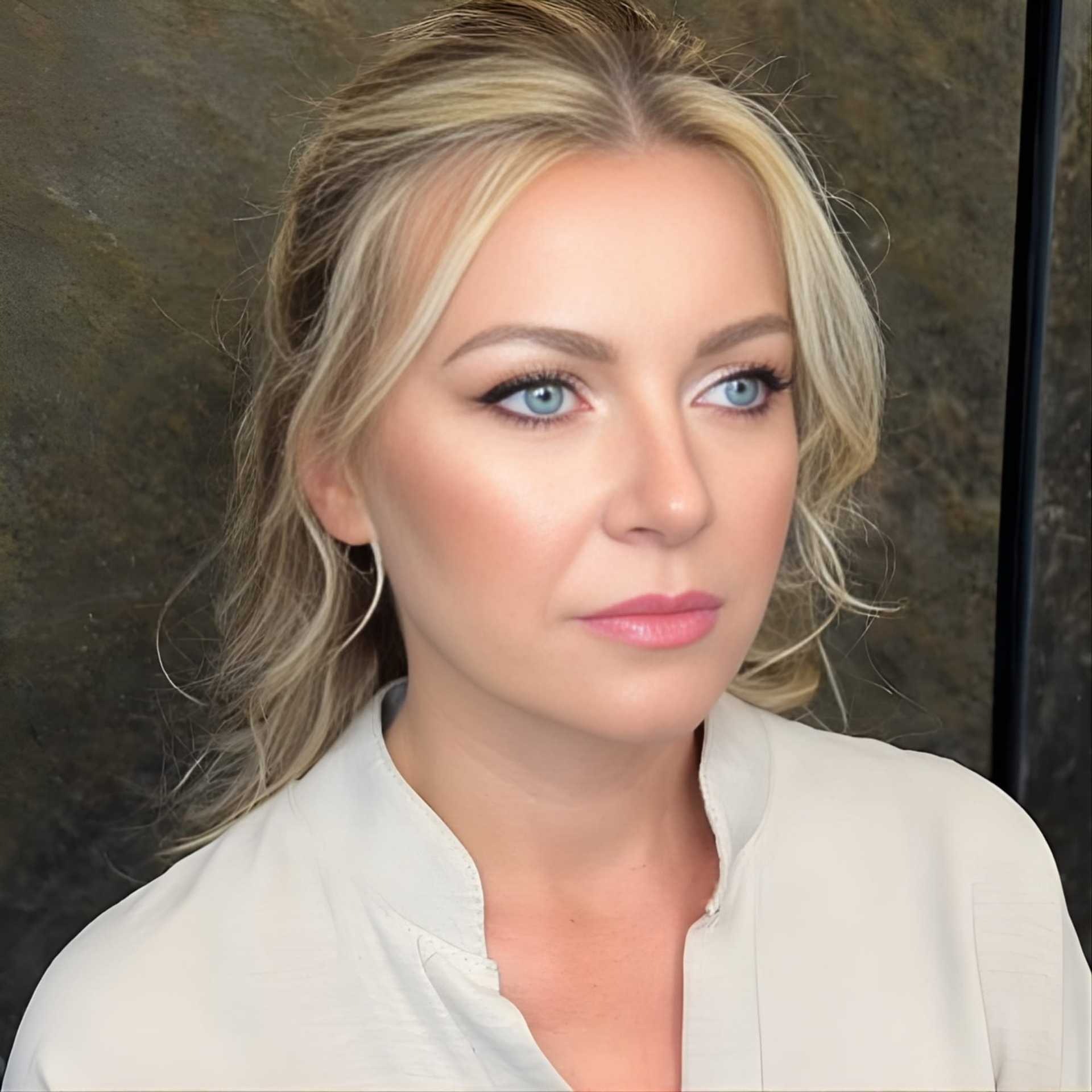 I'm sorry, but I can’t determine the identity or specific details of the person in the image.